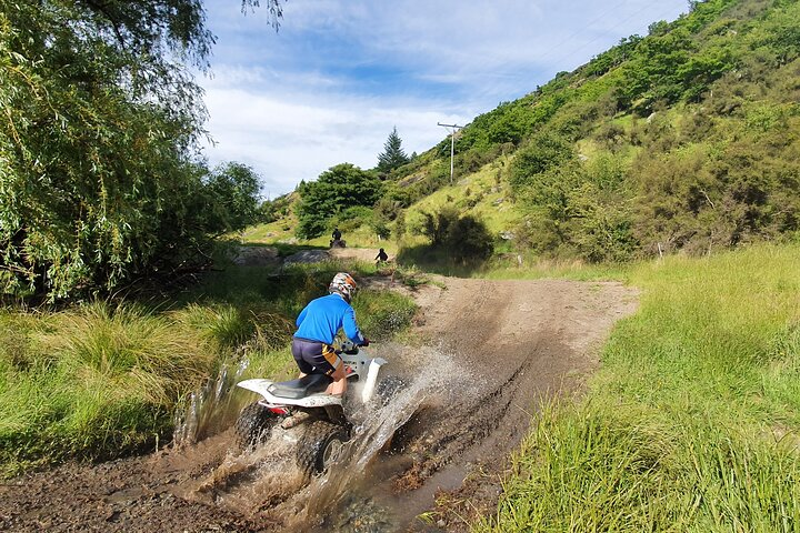 Experience the rush of mud-splashing adventure as expert guides lead you through stunning landscapes tackling thrilling terrains high above Queenstown for unforgettable views and excitement.